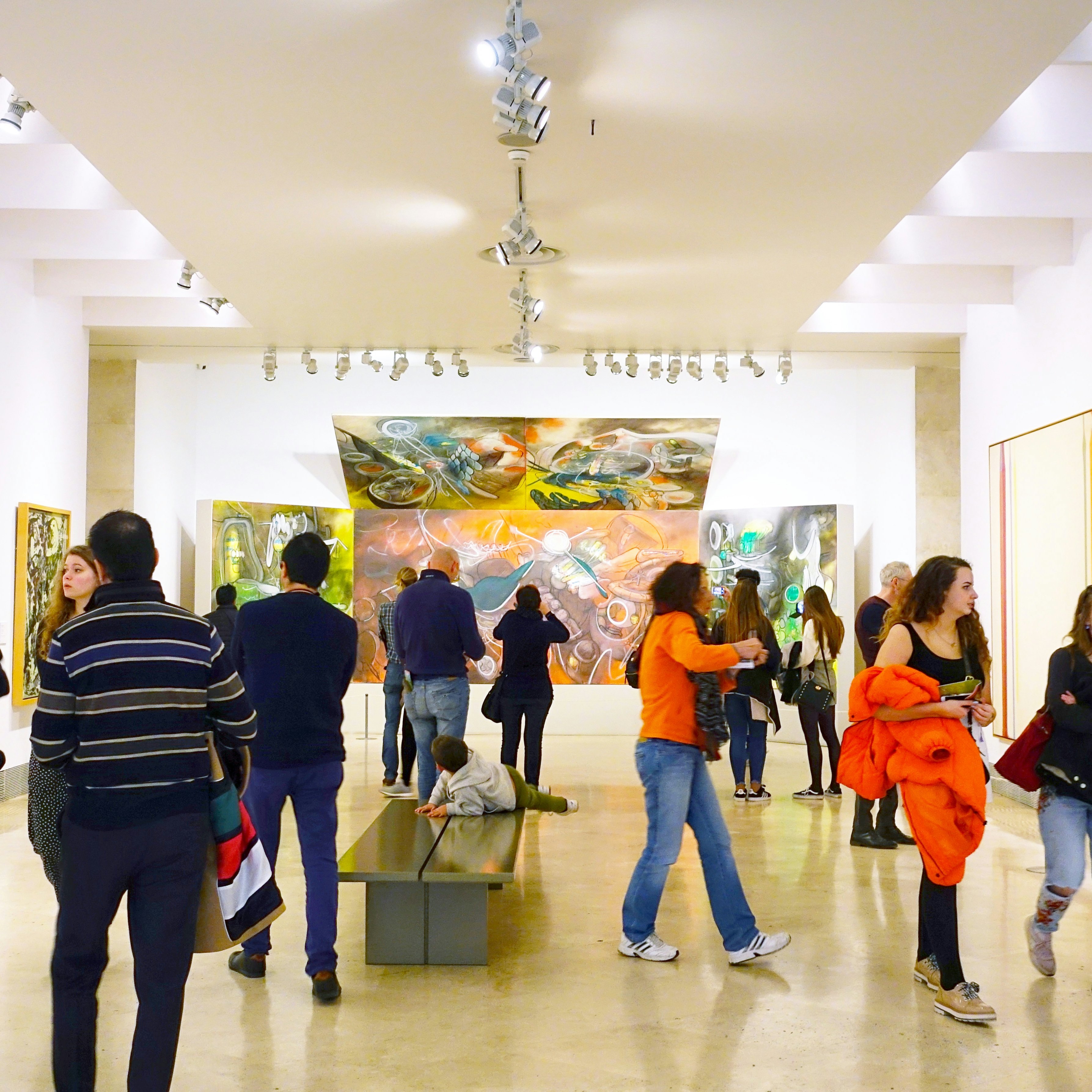 Visitors look at the pictures in the museum Thyssen-Bornemisza.